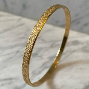 Vtg MONET Gold Brushed Textured Pebbly Thin Bangle. Size Sm/ Med